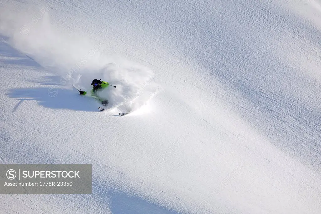 A male skier skis untracked powder in Haines, Alaska.