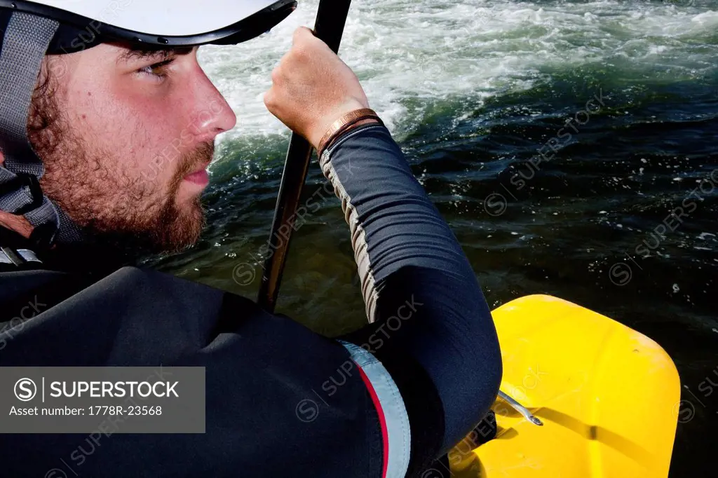 Close_up of a kayaker´s face while paddling the Clark Fork River, Missoula, Montana.