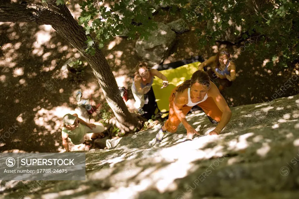 Spotted by her friends, a women boulders in Utah´s Wasatch Mountains.