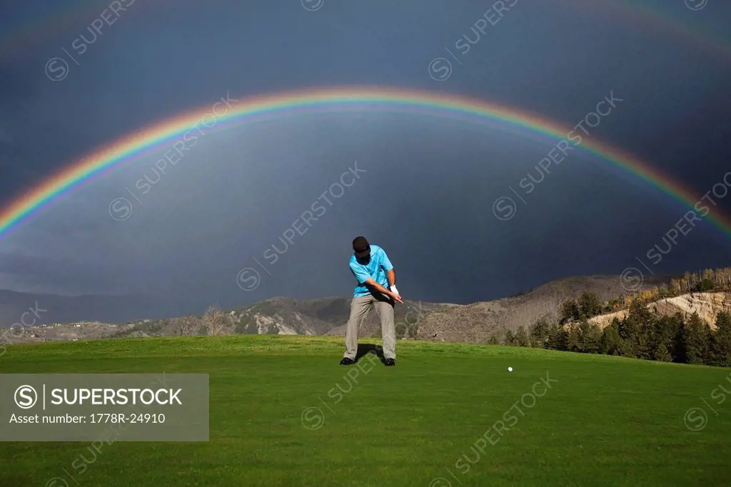 A golfer putts under an amazing double rainbow in Colorado.