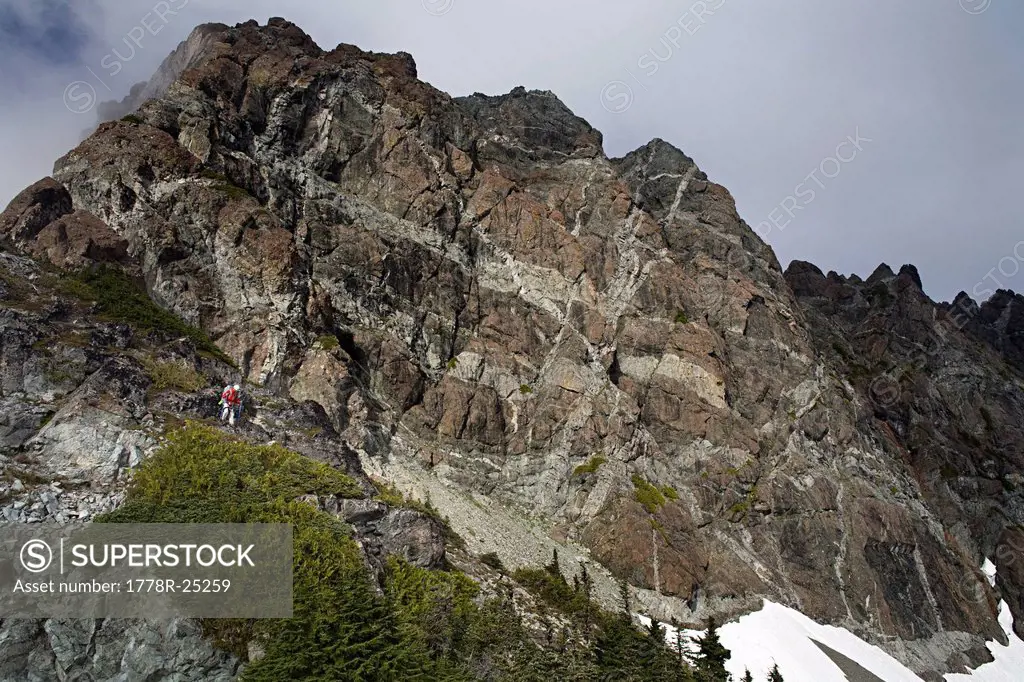 Climber descending off Mount Septimus, Strathcona Park, British Columbia.