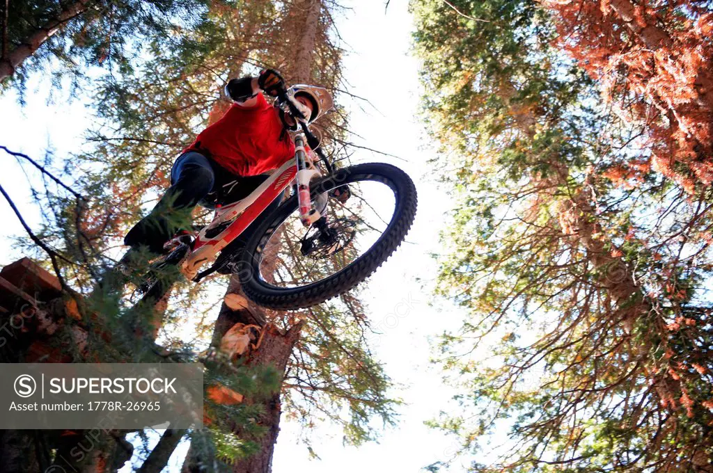 A mountain biker splashed in fall colors races down one of the many trails at Crested Butte Mountain Resort.