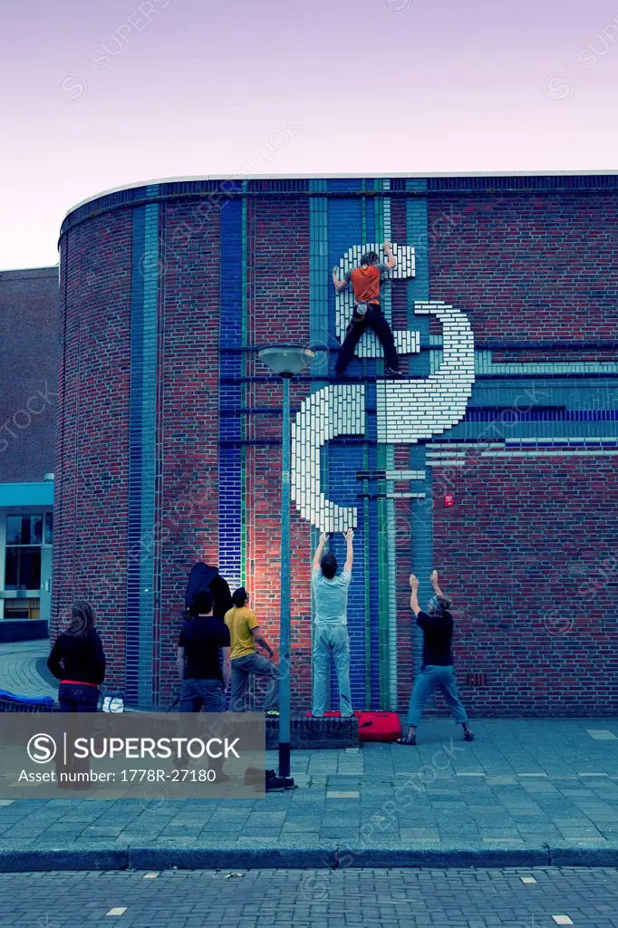 A Dutch climber on the first ascent of Augustinus College wall in Groningen, The Netherlands.