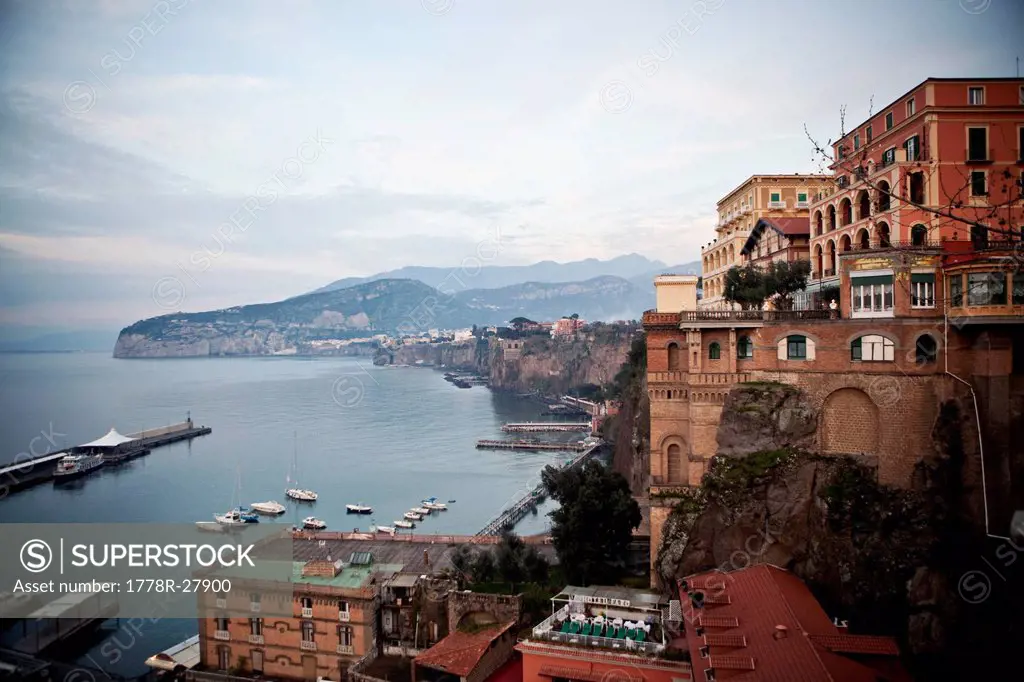 The town of Sorrento, Italy hugs the rugged cliffs overlooking the Bay of Naples.