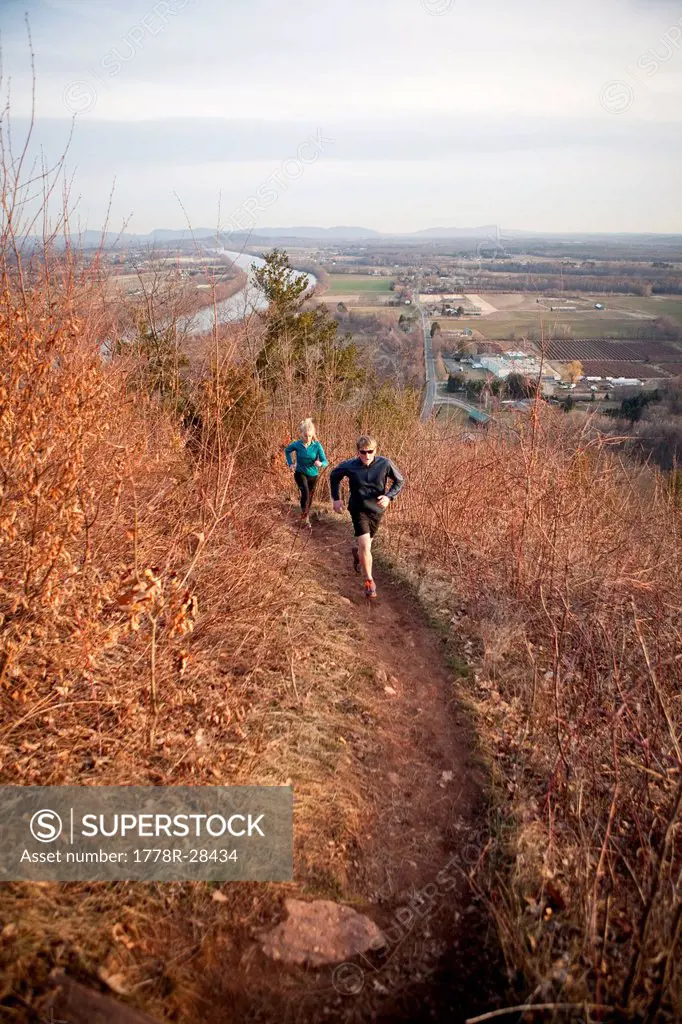 Trail runners acsend South Sugarloaf mountain in the Connecticut River Valley of western Massachusetts.