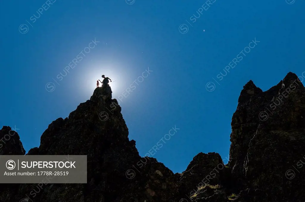 A man standing on a pointed ridge in the Rio Grande National Forest, Crestone, Colorado.