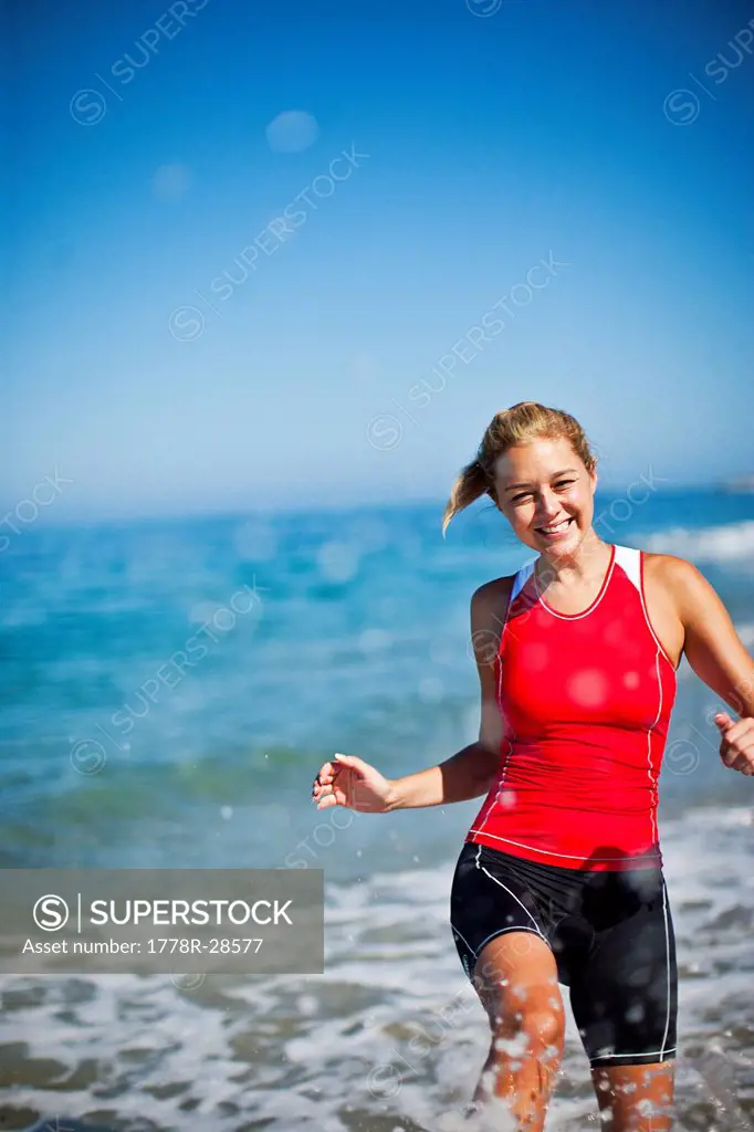Triathlon athlete running in the water