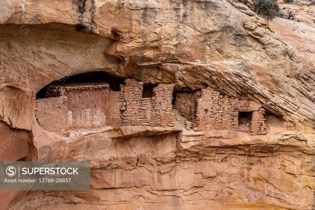 Indian ruins in a cave on the side of a cliff.