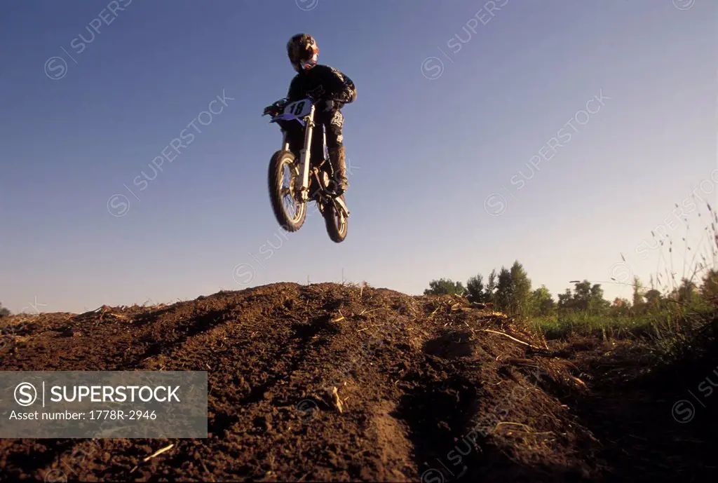 Catching air on a motocross bike.