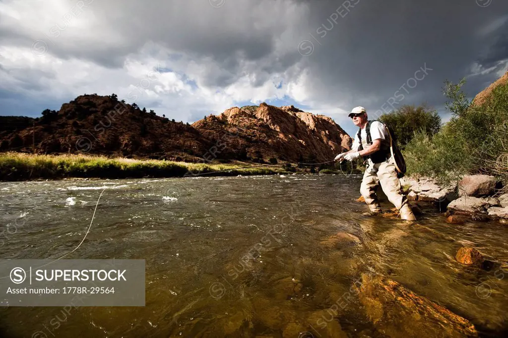 Man fly fishing in the Arkansas River in colorado