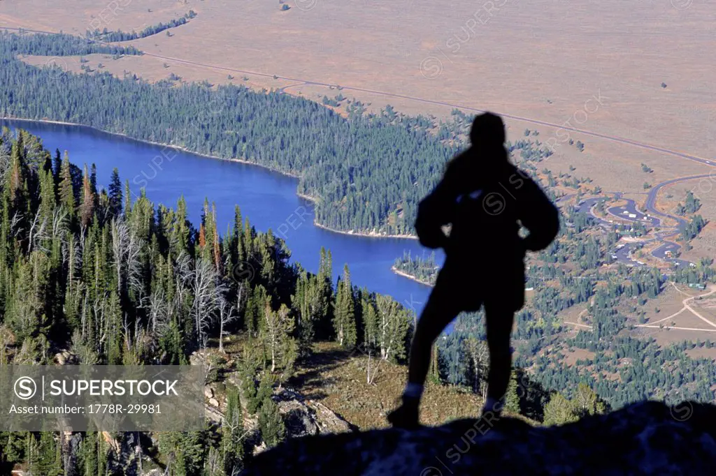 Hiker looks over the Jackson Hole valley, Wyoming, USA