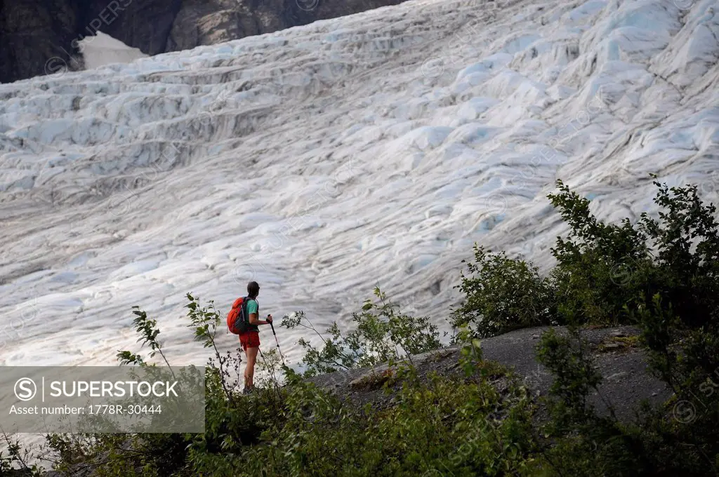Backpacker hikes the Harding Icefield Trail in Kenai Fjords National Park near Seward, Alaska.