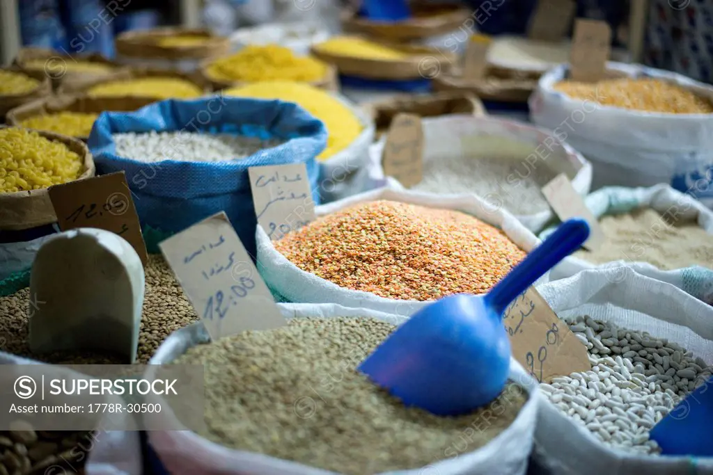 A detail of different grains for sale in the souk in Tangier, Morocco.