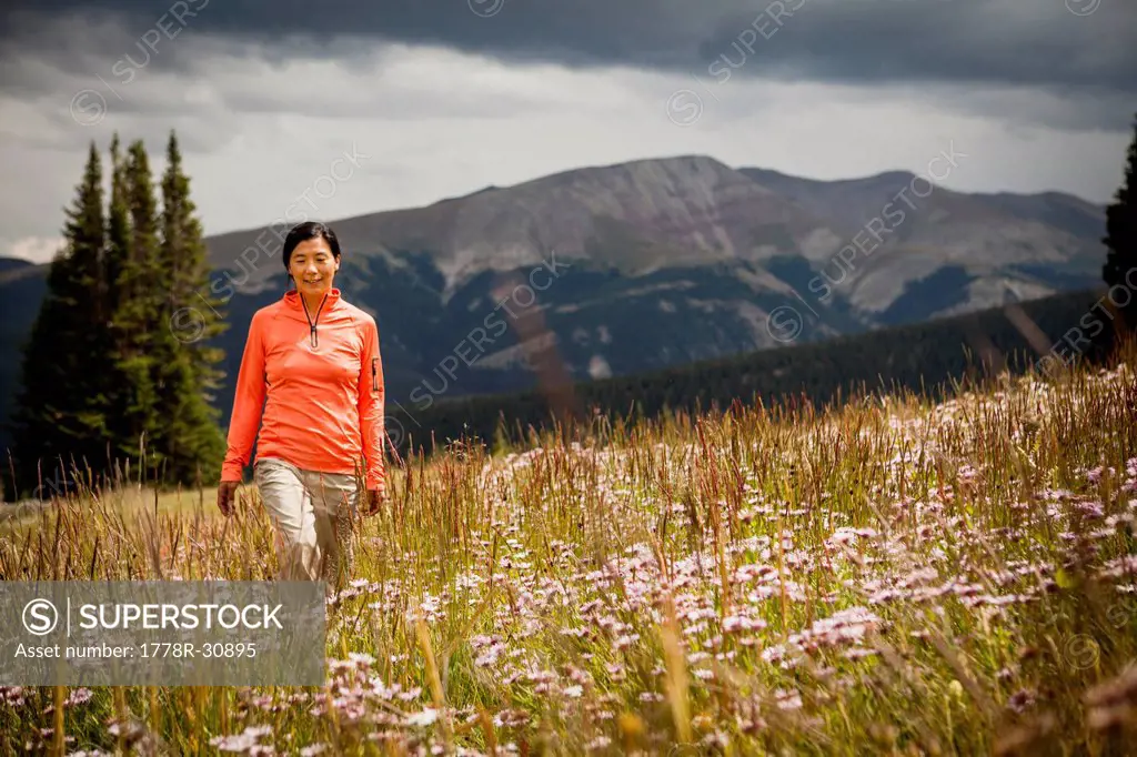 Woman walking in a meadow