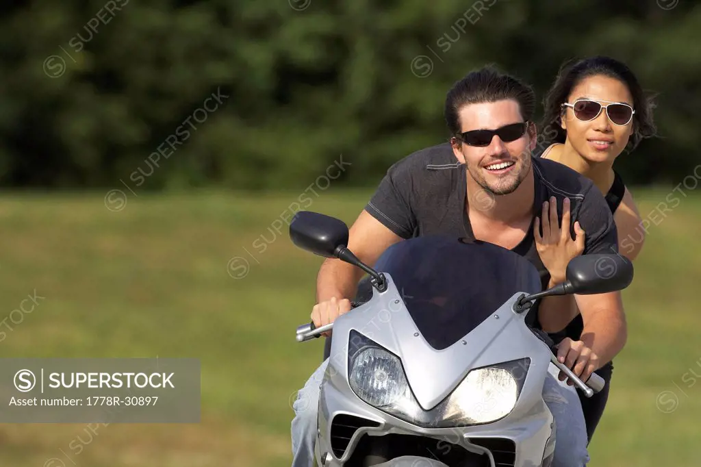 Young couple ridding on a motorcycle in Kansas