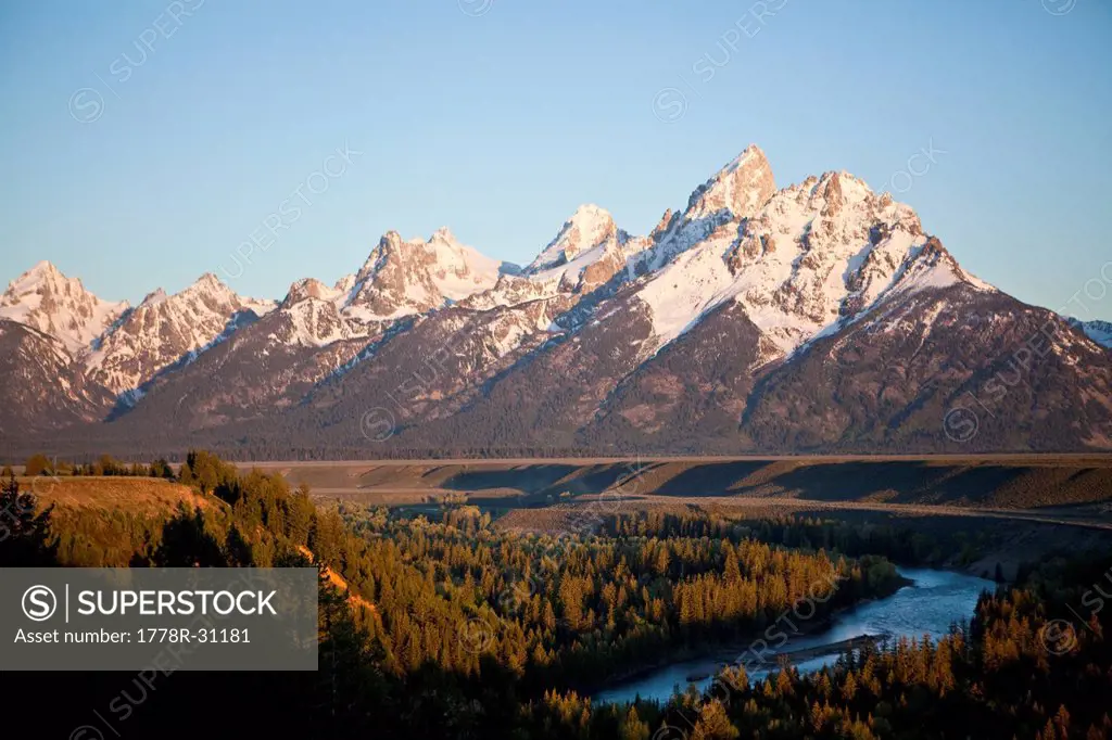 The Tetons loom over the Snake River and the valley of Jackson Hole, Wyoming.