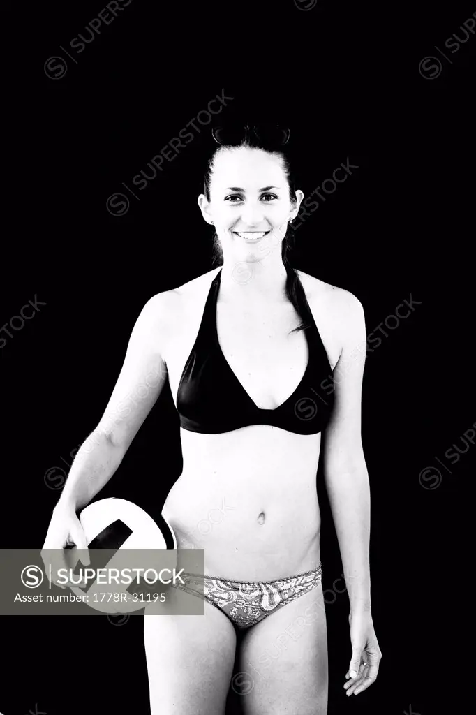 An athletic and toned female beach volleyball player poses for a portrait in Ventura, California.