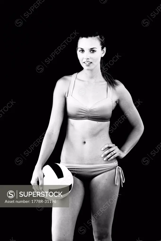 An athletic and toned female beach volleyball player poses for a portrait in Ventura.