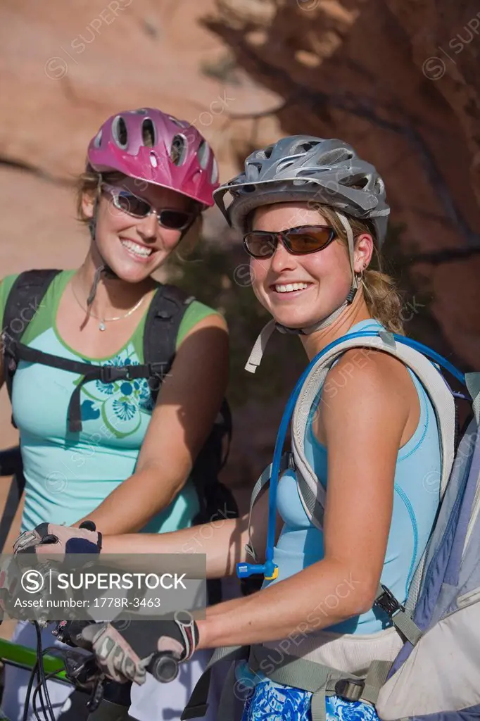 Portrait of two women mountain bikers.