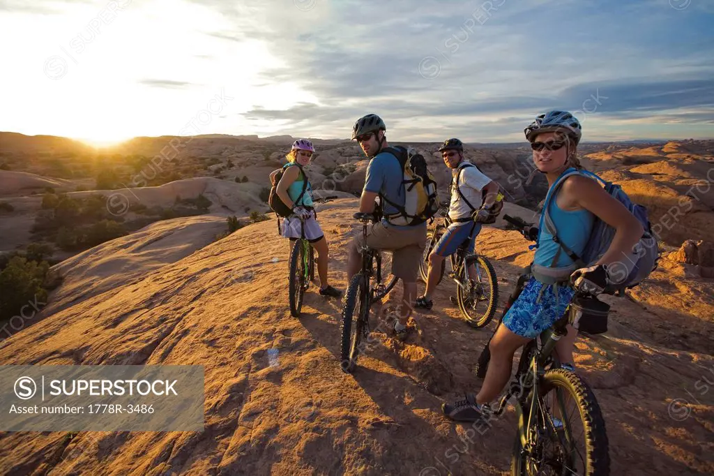 Group taking a break while mountain biking in Moab, Utah.