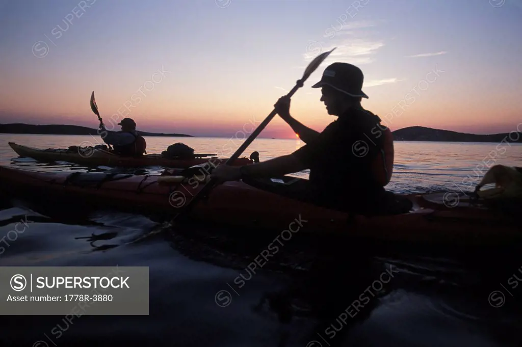 Kayaking at sunset in Croatia.