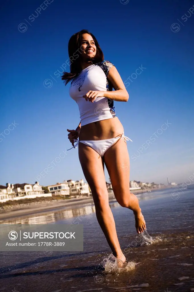 A young woman enjoys the beach.