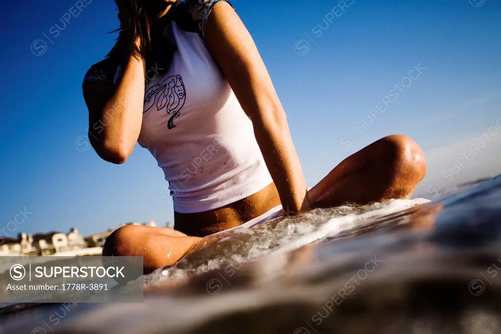 A young woman enjoys the beach.