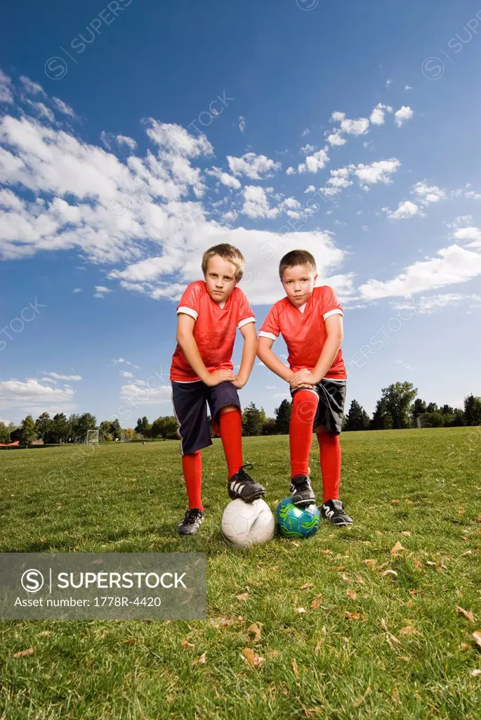 Two boys pose for a picture while playing soccer in Fort Collins, Colorado.