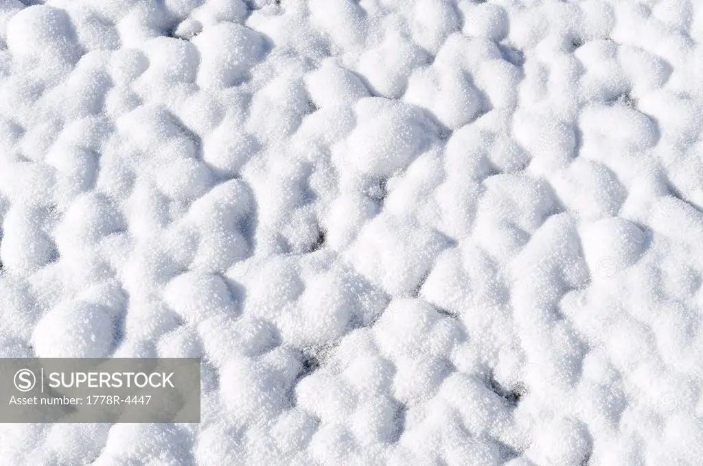 Patterns in the snow created by thermal features in Yellowstone National Park, Wyoming.