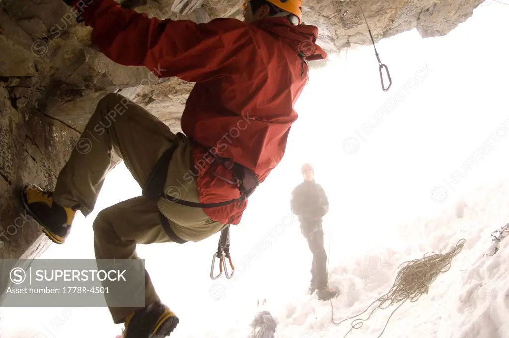 A man is belayed while rock climbing.
