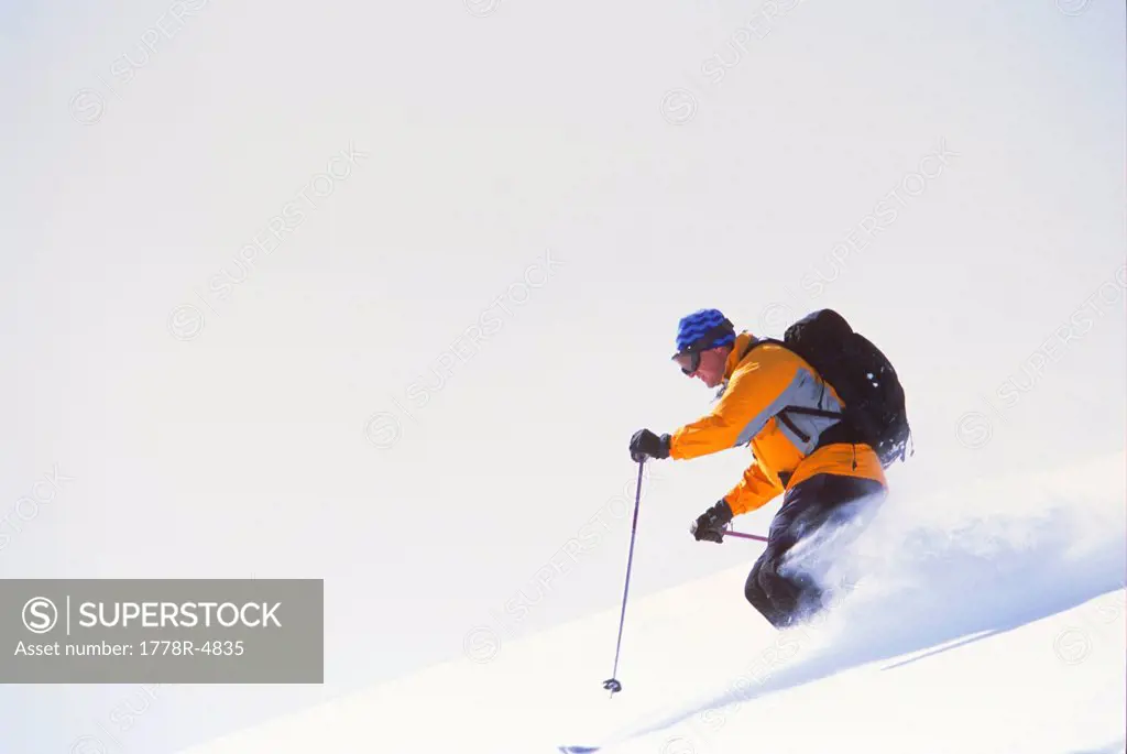 Solo male skiing in powder.