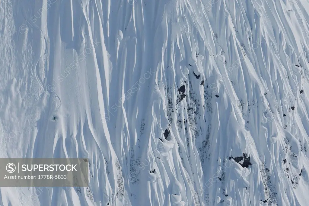 Skier making turns in steep terrain, Haines, Alaska.