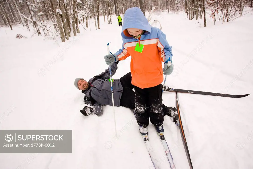 A family Cross Country Skiing in Dayton, Maine.