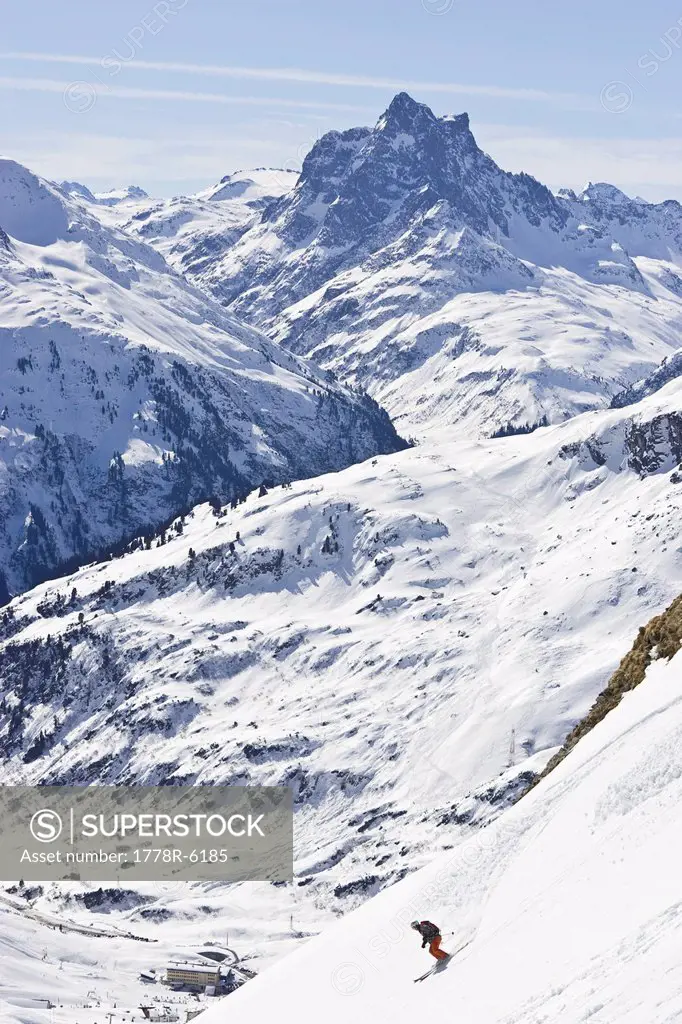 A young man skis down a steep slope at St. Anton am Arlberg, Austria.