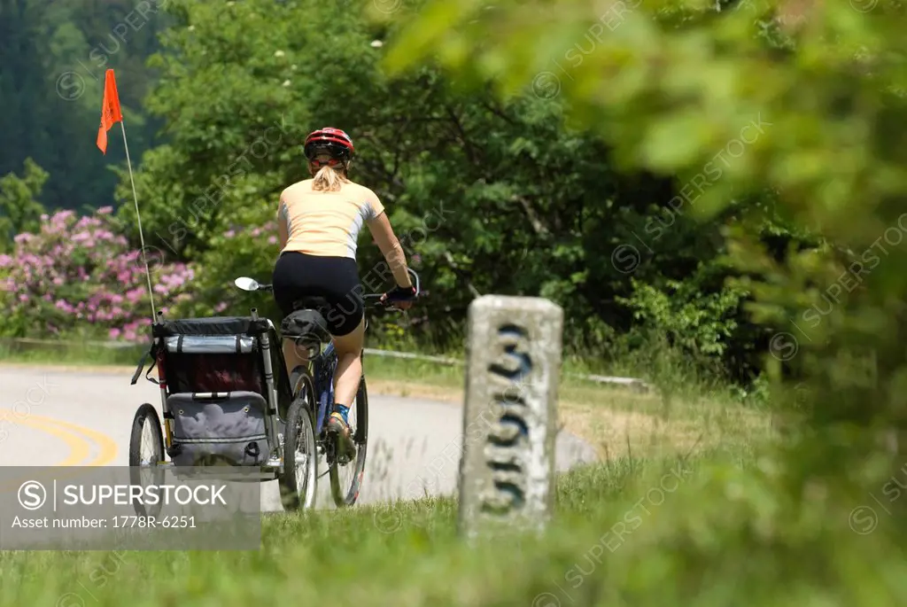 Woman biking on Blue Ridge Parkway, North Carolina.