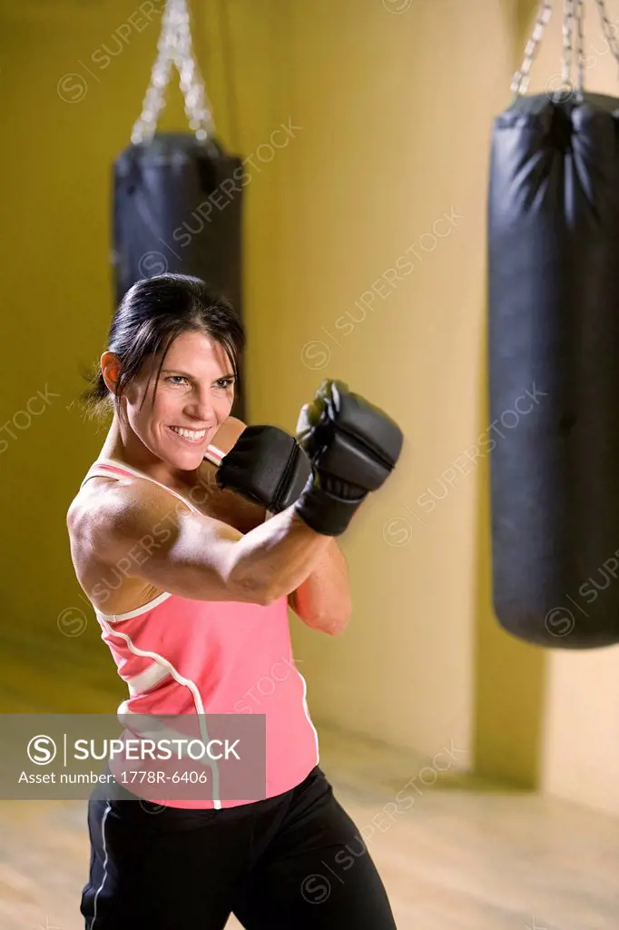 Woman boxing in a gym.