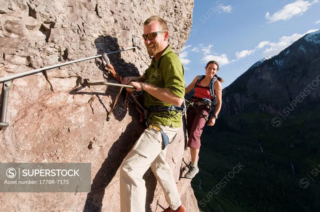 A man and woman rock climbing outside Telluride, Colorado.