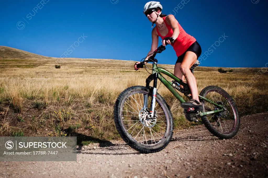 A female mountain biker pedals the trail on Mt. Sentinel, Missoula, Montana.