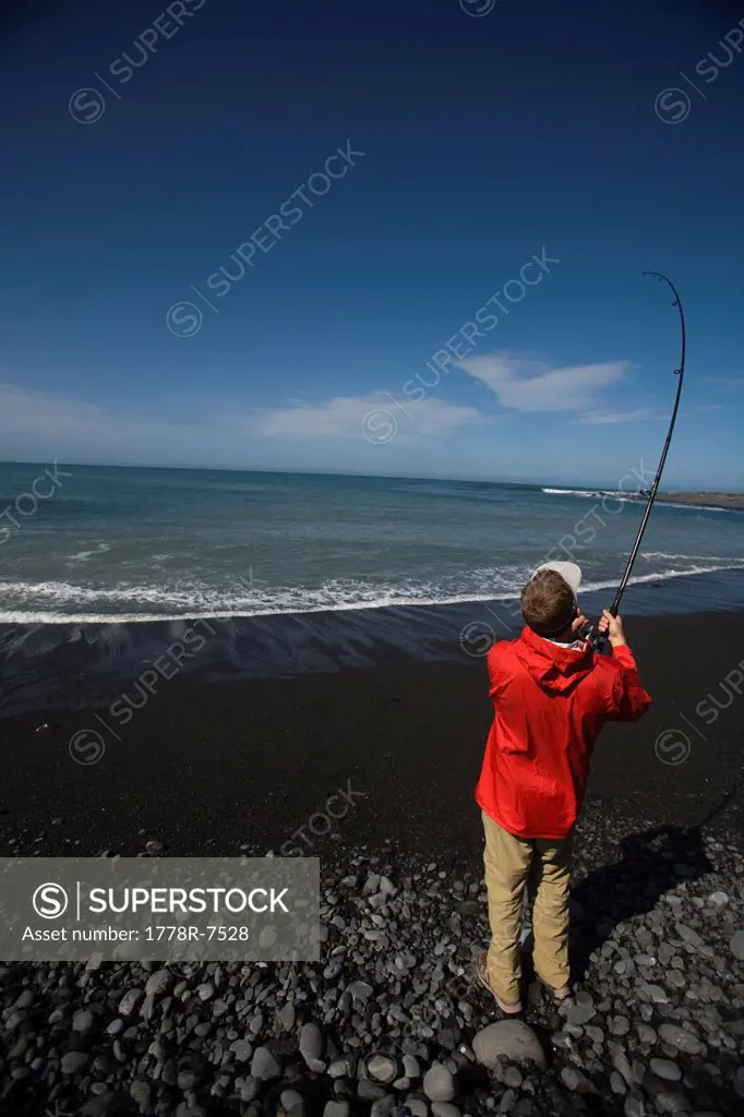 A man fishes in the Pacific Ocean off of The Lost Coast, California.