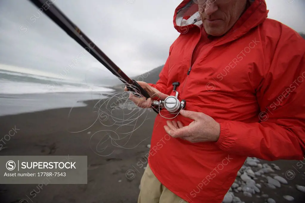 A man fishes in the Pacific Ocean off of The Lost Coast, California.