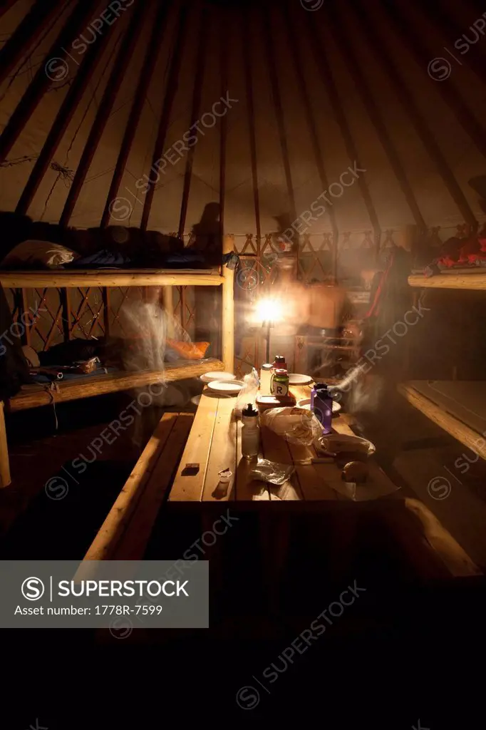 Hikers spend the night in bunkbeds in a yurt in the Wasatch Mountains, Utah.