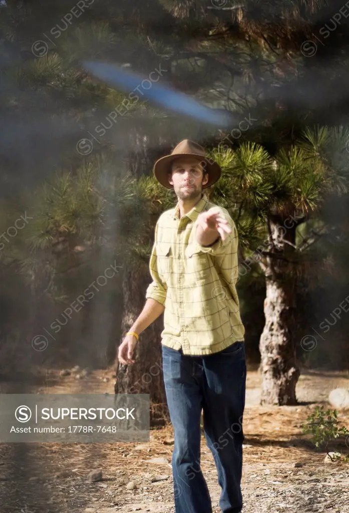 A young man shoots for par during a game of disc golf in Lake Tahoe, California.