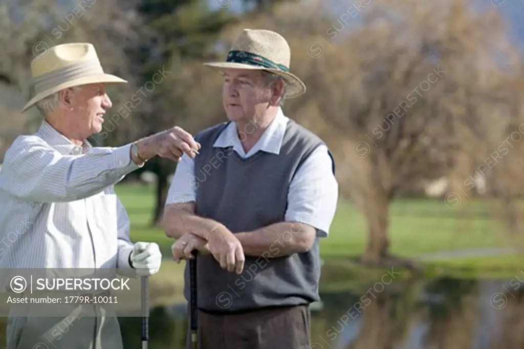 Senior men playing golf