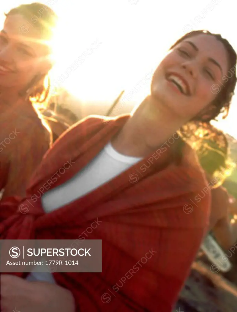 Woman laughing in bright sunlight