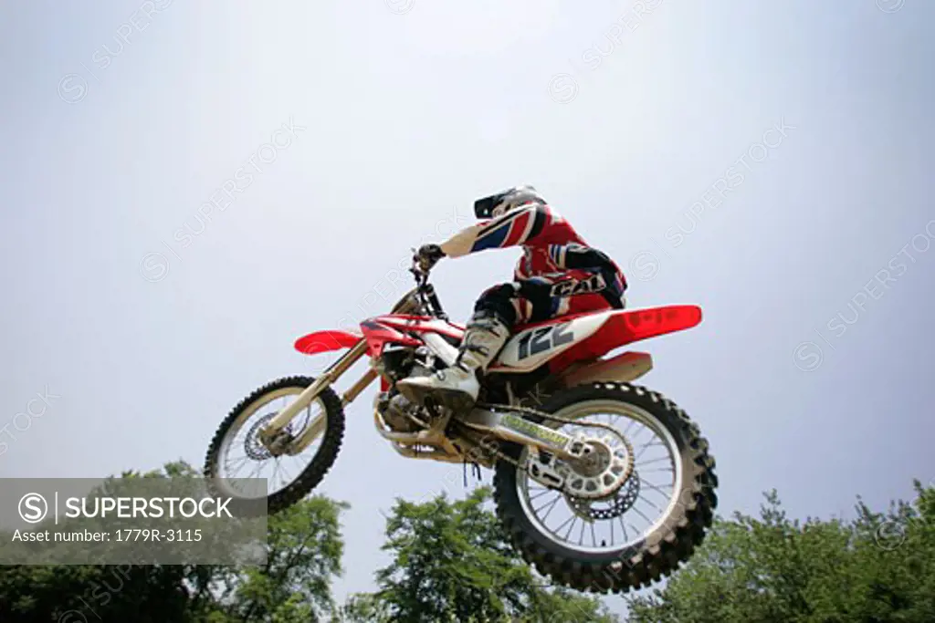 Motorcyclist jumping mid-air