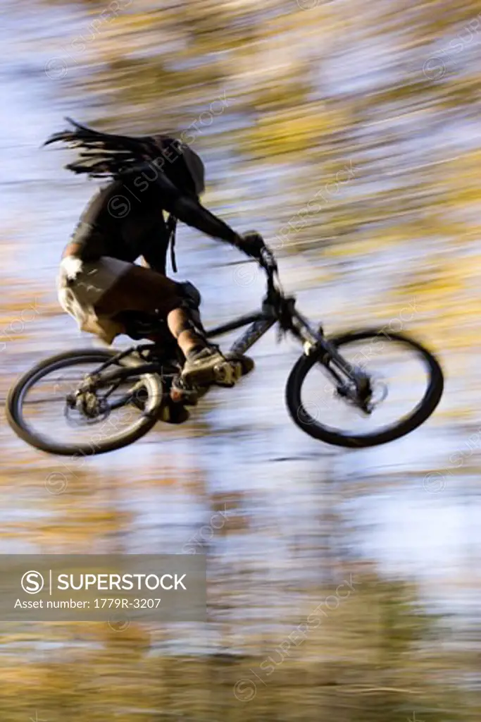 Blurred view of biker in the air