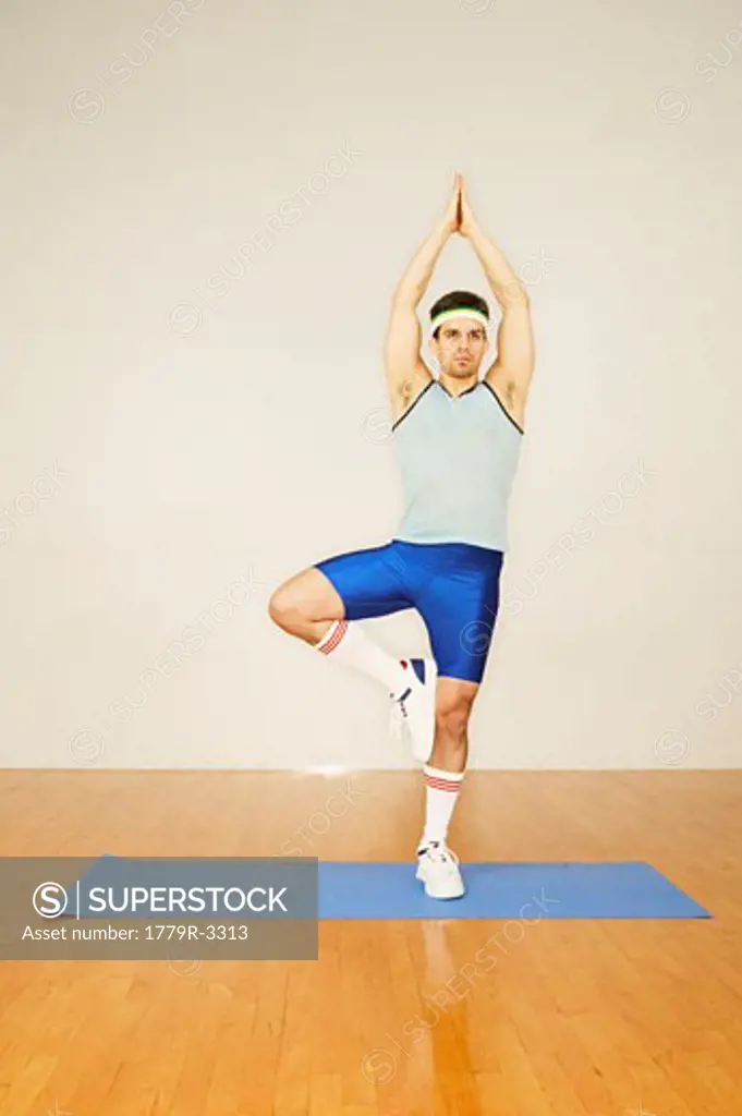 Man in exercise gear practising yoga