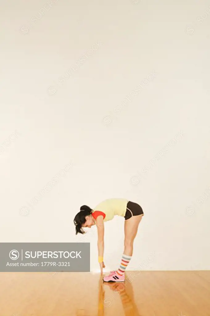 Woman in exercise clothing stretching