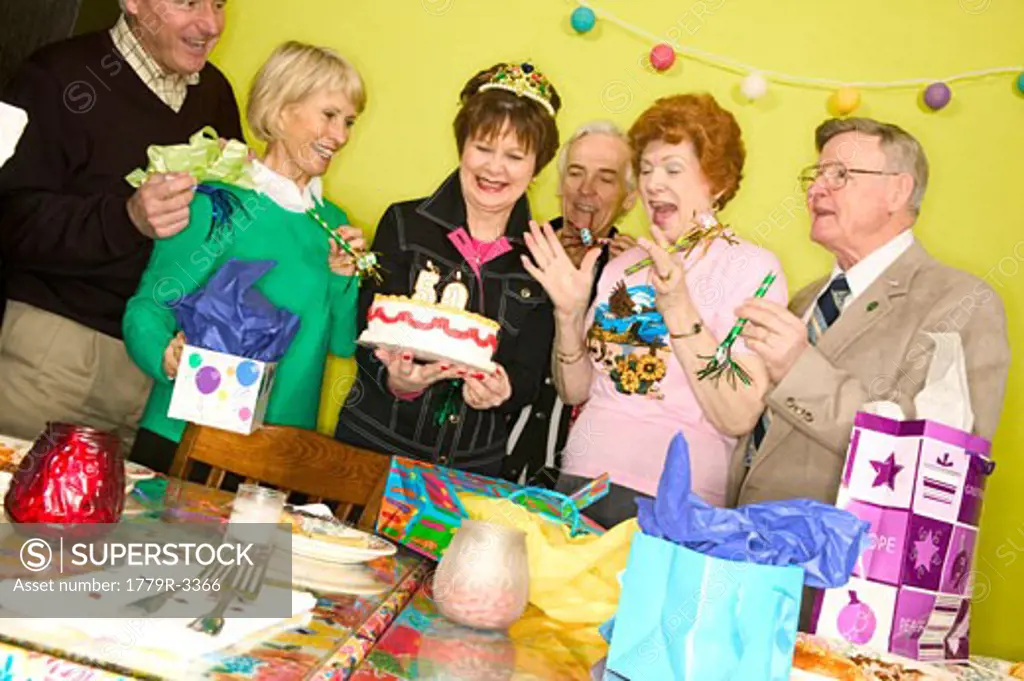 Group of friends celebrating woman's 50th birthday