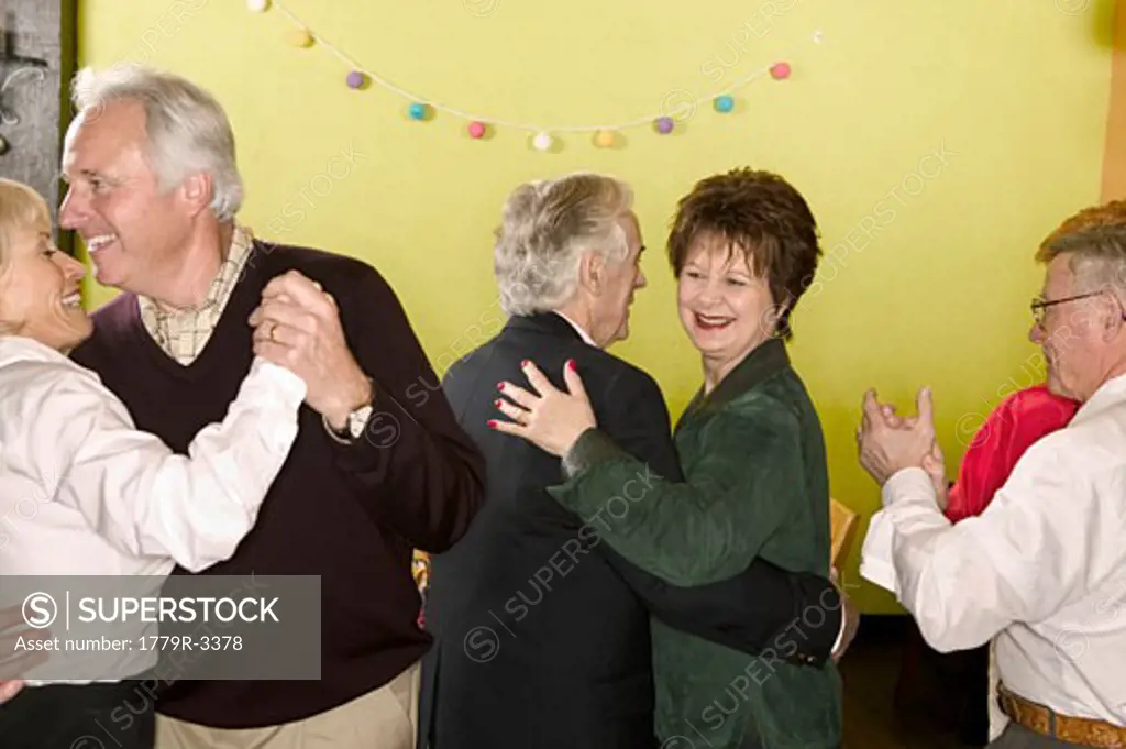 Senior couples dancing at a party
